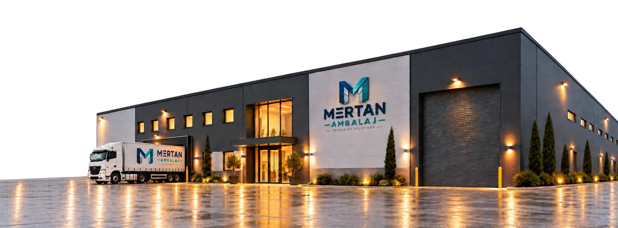 A modern packaging plant with anthracite and grey metal cladding, its lights on at dusk